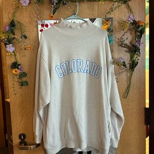 Arie Colorado over sized sweatshirt with short turtle neck and pockets.